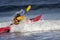 Kayaker in action fighting the wave on kayak