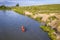 Kayaker on Dismal RIver in Nebraska