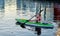 Kayaker paddling in water.