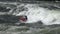 Kayaker rowing on the wild waters