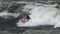 Kayaker rowing on the wild waters