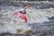 Kayaker surfing wave in Poudre River Whitewater Park
