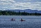 Kayakers enjoy summer day on Mirror Lake in Lake Placid, New York State