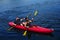 Kayakers enjoy summer day on Mirror Lake in Lake Placid, New York State