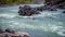 Kayakers navigating through the White Water Rapids and around Rocks