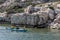 Kayakers paddle adjacent to the Sunken City of Simena on Kekova Island.
