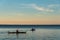 Kayakers paddling in Birch Bay in the late afternoon light, peaceful scenic landscape