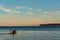 Kayakers paddling in Birch Bay in the late afternoon light, peaceful scenic landscape