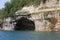 Kayakers paddling in a cave under the cliffs of Pictured Rocks National Lakeshore of Lake Superior, Munising, Michigan, USA