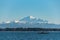 Kayakers paddling in Drayton Harbor on a sunny day with Mount Baker in the background