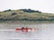 Kayakers paddling near nature reserve Het Oerd on West Frisian island Ameland in Waddensea, Friesland, Netherlands