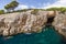 Kayakers at a sea cave at the Lokrum Island in Croatia