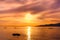 Kayakers Silhouette On Ocean During Orange Sunset