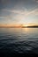 Kayakers and Stand-Up Paddleboarders enjoy sunset near White Rock, BC