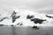 Kayaking in Antarctica, snow and cloudy