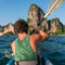 Kayaking around hight amazing Limestone Rocks at Railey Beach in Krabi, Thailand.