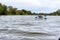 Kayaking on a calm river, young people rafting on the river