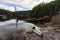 Kayaking in calm water with Canadian Mountain Landscape Background.