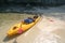 Kayaking with camping supplies on the beach at archipelago island