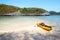 Kayaking with camping supplies on the beach at archipelago island