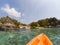 kayaking in crystal clear tropical waters - kayak heading to isolated beach in Ko Tarutao national park