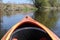 Kayaking in a kayak on Pilica river in Poland in spring on a sunny day with green trees