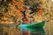 Kayaking on the river. A happy young pretty woman in a life jacket is floating in a kayak on the river. Concept of World