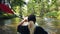 Kayaking on a river in the summer. A girl paddling with a paddle