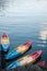 Kayaking sitting on the shore of a lake Concept Photo. Sport Colorful Plastic Kayak with water in the background. no people at Che