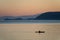 Kayaking at Sunset Through the San Juan Islands of Washington State.