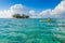 Kayaking in tropical paradise - Canoe floating on transparent turquoise water, caribbean sea, Belize, Cayes islands