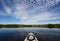 Kayaking under beautiful summer cloudscape reflected on Nine Mile Pond in Everglades National Park, Florida.