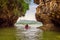 Kayaking under high cliffs in Thailand