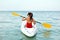 Kayaking. Woman Traveling In Canoe At Sea Back View