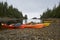 Kayaks with fishing rods on shore