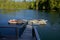 Kayaks lined up on a dock in a bay in Nuchatlitz Provincial Park