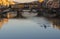 Kayaks on the river Arno floating near St Trinity Bridge and Ponte Vecchio