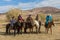 Kazakh Berkutchi Eagle hunters on horseback.