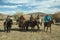 Kazakh Eagle hunters on horseback.