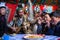 Kazakh family of hunters with hunting birds golden eagles inside the mongolian Yurt.