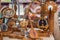 Kazakh national handmade musical instruments with horsehair strings are sold on a street stall on a sunny day.