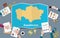 Kazakhstan country growth nation team discuss with fold maps view from top