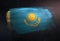 Kazakhstan Flag Made of Metallic Brush Paint on Grunge Dark Wall