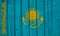 Kazakhstan Flag Over Wood Planks