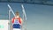 KAZAN, RUSSIA - APRIL 18, 2018: All-Russian gymnastics championship - Male gymnast does a leap on uneven bar