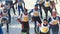 KAZAN, RUSSIA - March, 2018: group of teenagers skiers running at snow sunny day