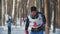 KAZAN, RUSSIA - MARCH, 2018: Young girl skier running on ski-track on cross-country skiing in sunny winter day