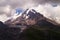 Kazbek. Peak. The highest point of Georgia. High mountain against the sky with clouds.