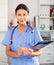 Kazhahstani female medic in uniform standing in doctor`s office