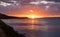 Kea, Tzia island, destination Greece. Sunset, sunrise orange through clouds background